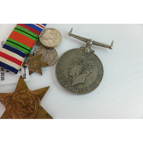 241 - Two World War II Medals together with a Bar holding Three Miniature World War II Medals