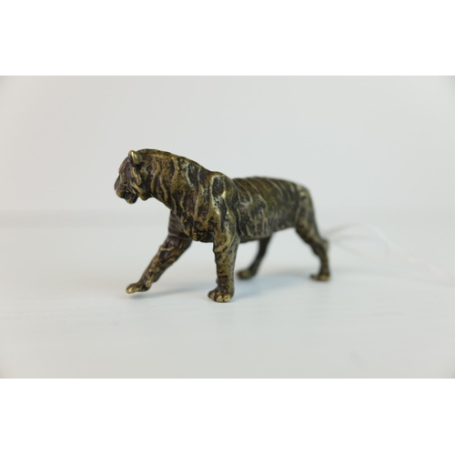 283 - A brass/bronze figure of a tiger.