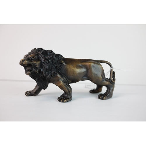 288 - a brass bronze figure of a lion.