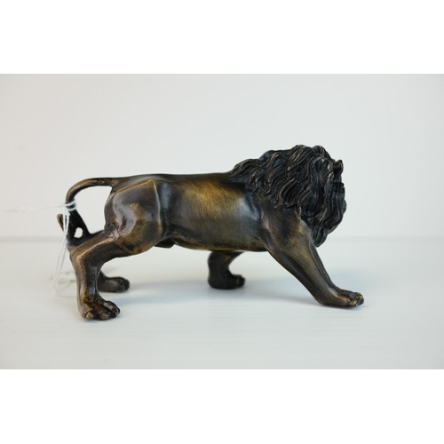 288 - a brass bronze figure of a lion.