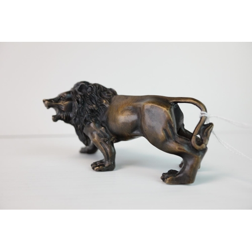 288 - a brass bronze figure of a lion.