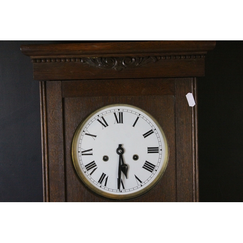 688 - Early 20th century Oak Cased Eight Day Hanging Wall Clock, the white enamel face with arabic numeral... 