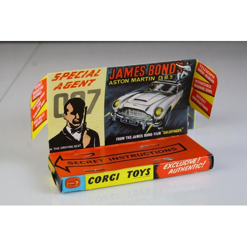 1006 - Boxed Corgi 261 James Bond 007 Aston Martin diecast model, complete with figures, unused missiles & ... 