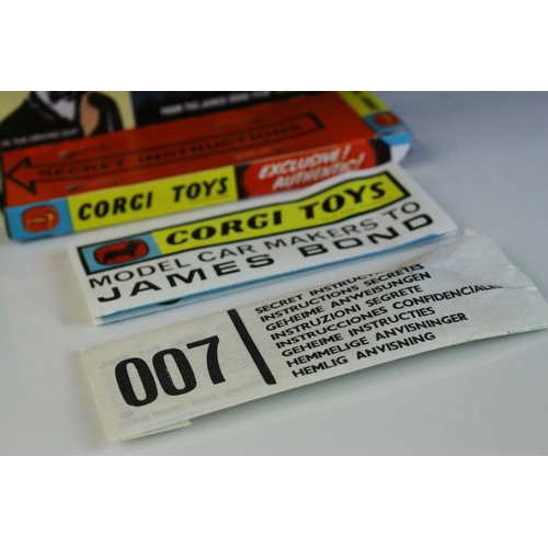 1012 - Boxed Corgi 261 James Bond 007 Aston Martin diecast model, complete with figures, unused missiles & ... 