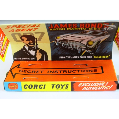 1012 - Boxed Corgi 261 James Bond 007 Aston Martin diecast model, complete with figures, unused missiles & ... 