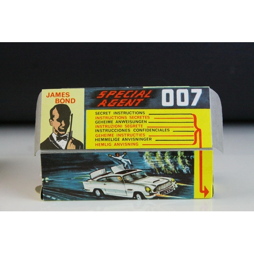 1012 - Boxed Corgi 261 James Bond 007 Aston Martin diecast model, complete with figures, unused missiles & ... 