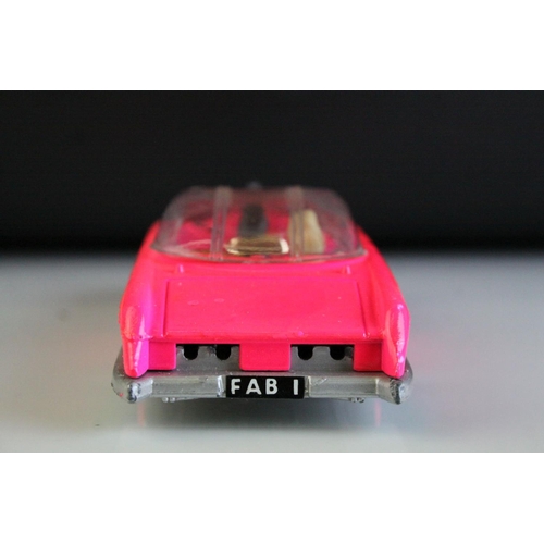 1014 - Boxed Dinky 100 Thunderbirds Lady Penelope's FAB 1 fluorescent pink diecast model, complete with inn... 