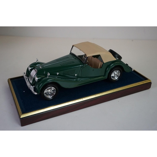 1168 - Five cased 1:18 scale diecast model vintage cars to include Mercedes, Morgan etc, models fixed to a ... 