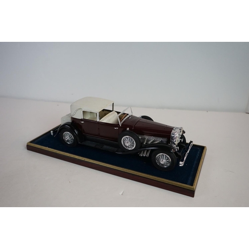 1168 - Five cased 1:18 scale diecast model vintage cars to include Mercedes, Morgan etc, models fixed to a ... 