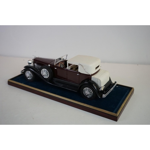 1168 - Five cased 1:18 scale diecast model vintage cars to include Mercedes, Morgan etc, models fixed to a ... 