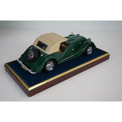 1168 - Five cased 1:18 scale diecast model vintage cars to include Mercedes, Morgan etc, models fixed to a ... 