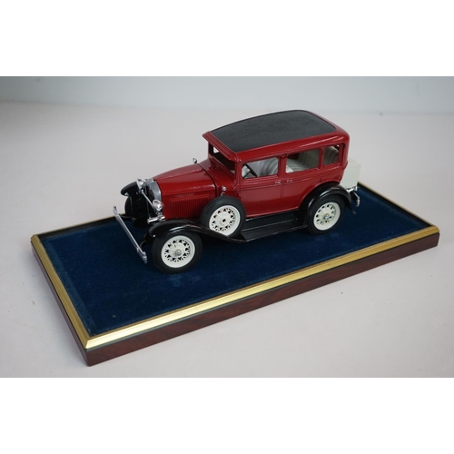 1168 - Five cased 1:18 scale diecast model vintage cars to include Mercedes, Morgan etc, models fixed to a ... 