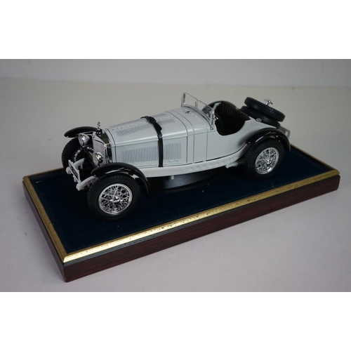 1168 - Five cased 1:18 scale diecast model vintage cars to include Mercedes, Morgan etc, models fixed to a ... 