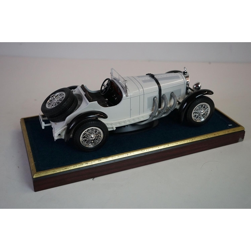 1168 - Five cased 1:18 scale diecast model vintage cars to include Mercedes, Morgan etc, models fixed to a ... 