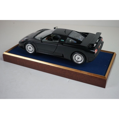 1171 - Five cased 1:18 scale diecast model classic cars, to include MG, Ferrari, Bugatti, Aston Martin & Me... 