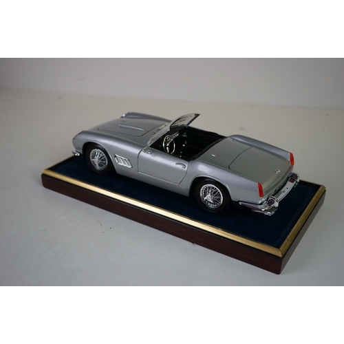 1171 - Five cased 1:18 scale diecast model classic cars, to include MG, Ferrari, Bugatti, Aston Martin & Me... 