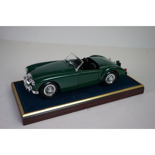 1171 - Five cased 1:18 scale diecast model classic cars, to include MG, Ferrari, Bugatti, Aston Martin & Me... 