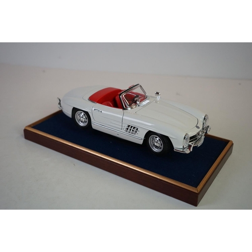 1171 - Five cased 1:18 scale diecast model classic cars, to include MG, Ferrari, Bugatti, Aston Martin & Me... 