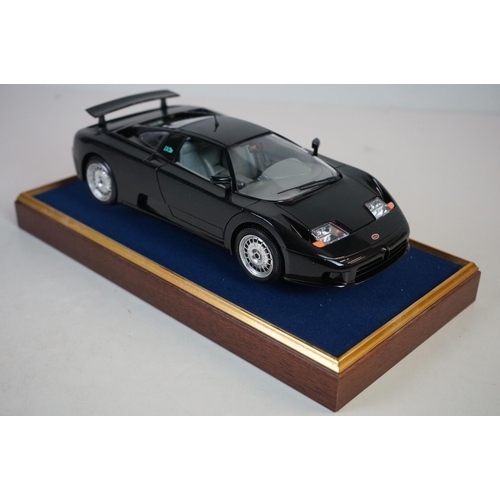 1171 - Five cased 1:18 scale diecast model classic cars, to include MG, Ferrari, Bugatti, Aston Martin & Me... 