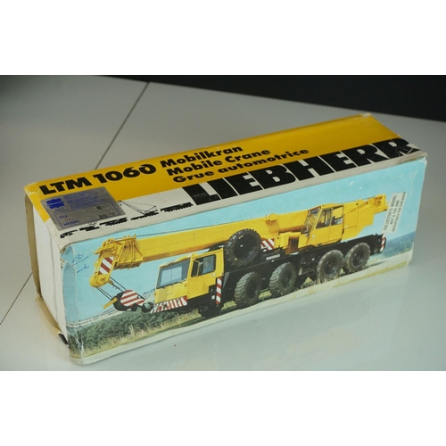 1229 - Three boxed 1/50 Conrad Liebherr diecast construction models to include 2 x LTM 1060 (variants) and ... 