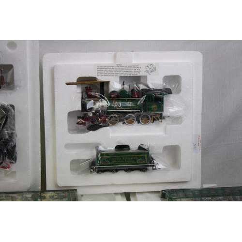 188 - Boxed HO Gauge Thomas Kinkade Christmas Express  electric train set to include engine, tender, 7 x c... 