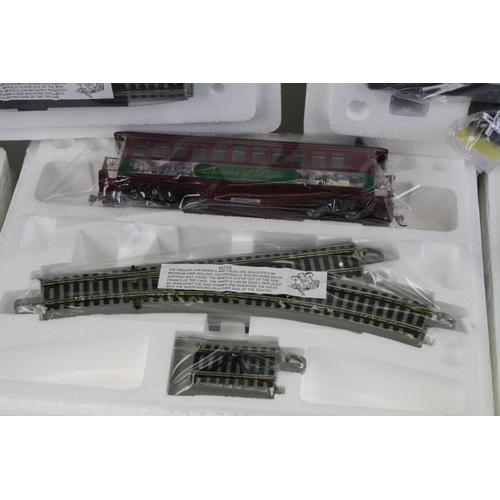 188 - Boxed HO Gauge Thomas Kinkade Christmas Express  electric train set to include engine, tender, 7 x c... 