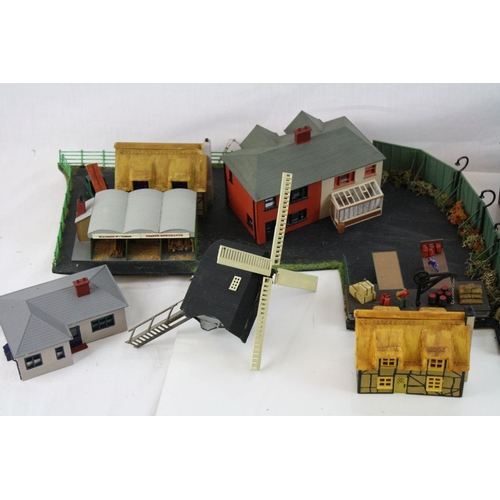 214 - Large quantity of OO gauge model railway accessories to incldue trackside buildings and track