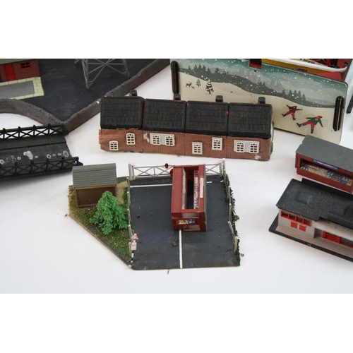 214 - Large quantity of OO gauge model railway accessories to incldue trackside buildings and track