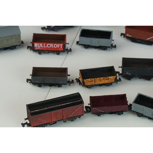 244 - 31 N gauge items of rolling stock to include Peco, Graham Farish, Trix etc featuring vans and wagons... 