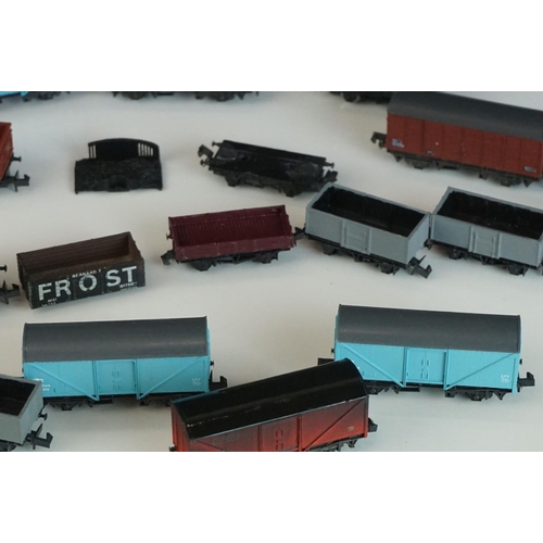 244 - 31 N gauge items of rolling stock to include Peco, Graham Farish, Trix etc featuring vans and wagons... 