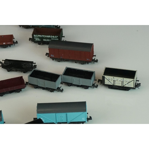 244 - 31 N gauge items of rolling stock to include Peco, Graham Farish, Trix etc featuring vans and wagons... 