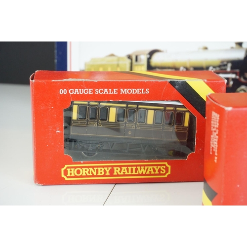 261 - Four boxed OO gauge locomotives to include 2 x Hornby (R072 BR Class 25 Diesel green & R355 MR 4-4-0... 