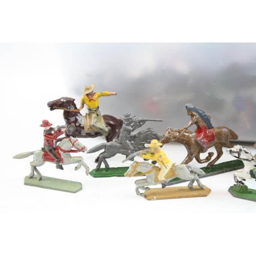 301 - Quantity of vintage metal figures mainly Wild West on horseback, some paint loss and play wear