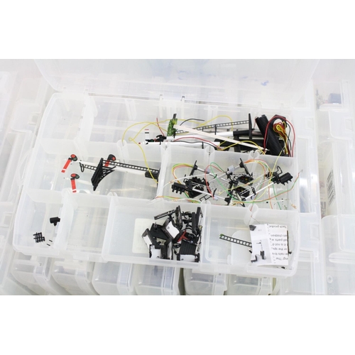 82 - Quantity of model railway accessories and parts to include switches, tools, signals, couplings, coac... 