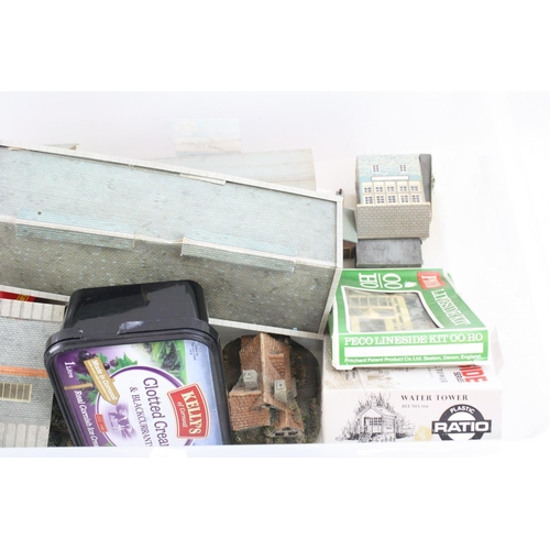 90 - Quantity of OO gauge trackside buildings featuring plastic, cardboard and composition examples, incl... 