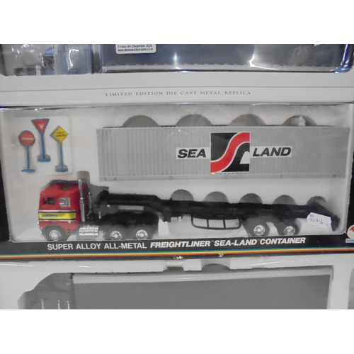 1164 - Four boxed diecast commercial vehicles to include Shinsei Freightliner Sea-Land Container, SpecCast ... 