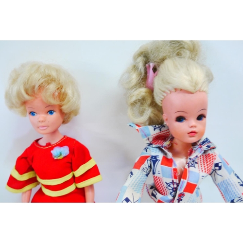 336 - Two original Hong Kong Sindy dolls with clothing and accessories, both appearing vg, with some custo... 