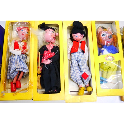 338 - Four boxed Pelham Puppets to include Tufty the Squirrel, Dutch Girl, Dutch Boy and Witch, plus three... 