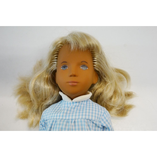 353 - Sasha 105 Blonde doll with original gingham dress, vg condition