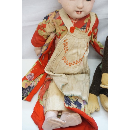 359 - Two early-mid 20th C Oriental dolls, one with glass eyes, one painted, both showing wear,  plus a gr... 