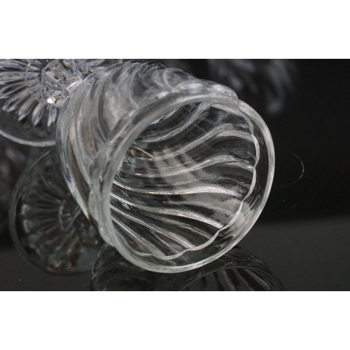 146 - Part suite of moulded and cut glass port and wine glasses, the bowls with spiral decoration (nine wi... 