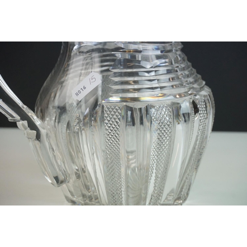 149 - Three late 18th/ early 19th Century Anglo-Irish glass water jugs, with various hobnail and cross hat... 