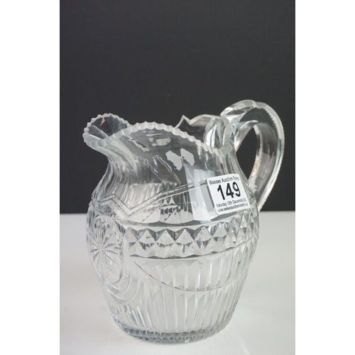 149 - Three late 18th/ early 19th Century Anglo-Irish glass water jugs, with various hobnail and cross hat... 