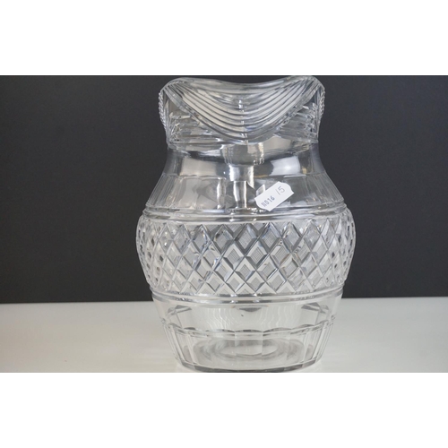 149 - Three late 18th/ early 19th Century Anglo-Irish glass water jugs, with various hobnail and cross hat... 