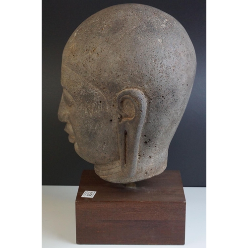 155 - Large Composite Stone Buddha Head mounted on a Wooden Block Base, total height 49cms