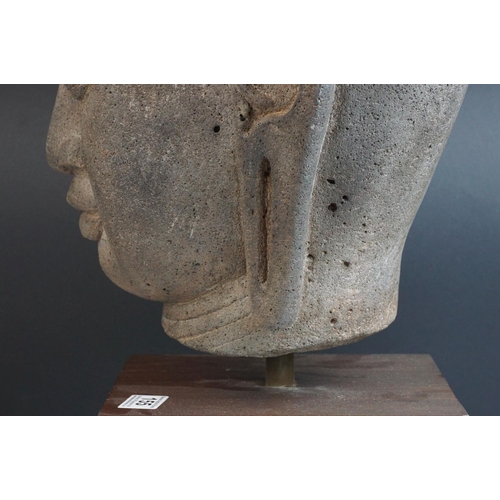155 - Large Composite Stone Buddha Head mounted on a Wooden Block Base, total height 49cms