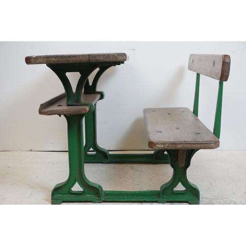 134 - Late 19th / Early 20th century Child's Pine combined Double Desk and Seat, with a green painted cast... 