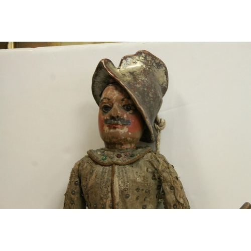 262 - Two large carved wooden dolls with painted faces in 18th century costume believed to be Continental.