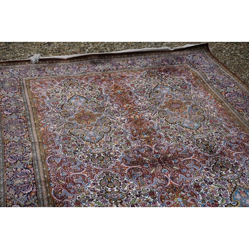 890 - Eastern style Silk Rug, the stylised pattern including foliage, 306cms x 183cms