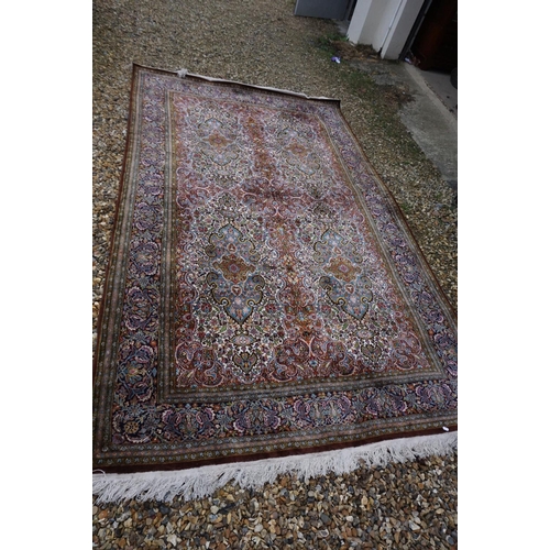 890 - Eastern style Silk Rug, the stylised pattern including foliage, 306cms x 183cms
